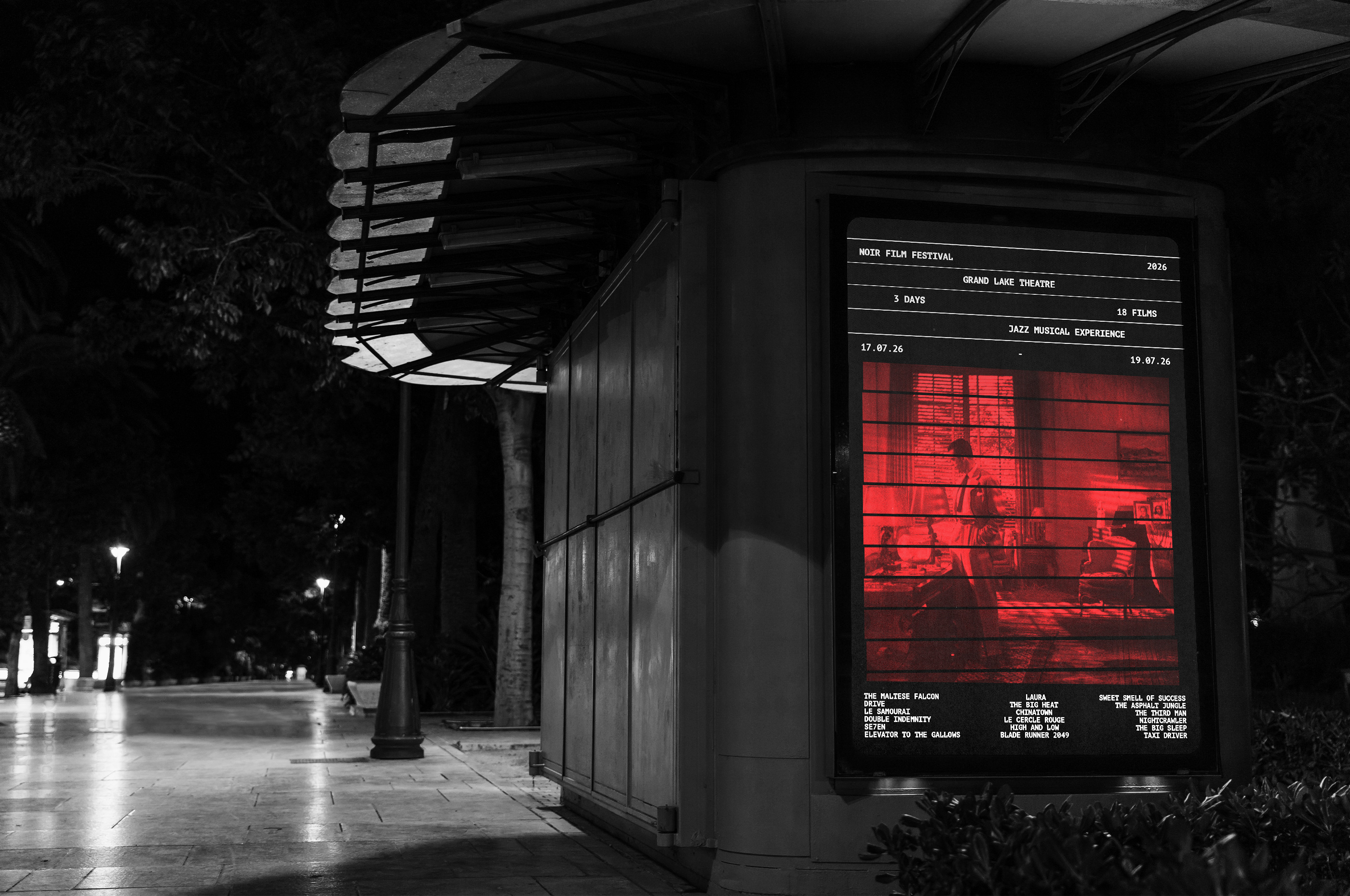 Festival poster in a street kiosk at night
